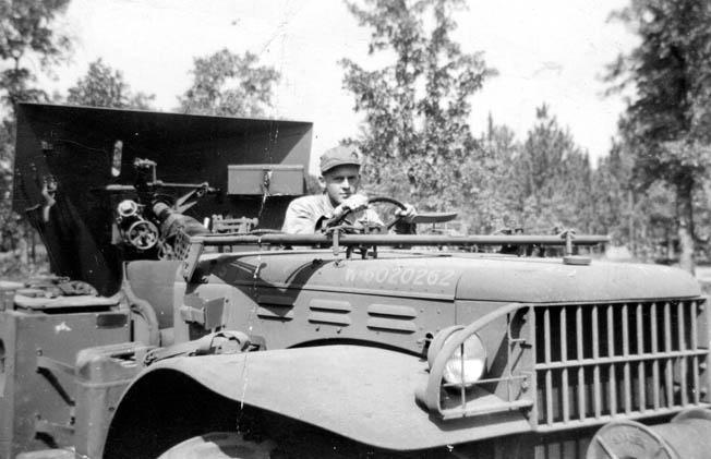 Private Bromberg drives a weapons carrier pulling an artillery piece at Fort Knox, where he learned to double clutch a tank to slow it down. After the war his father did not appreciate this skill when applied to the family car. 