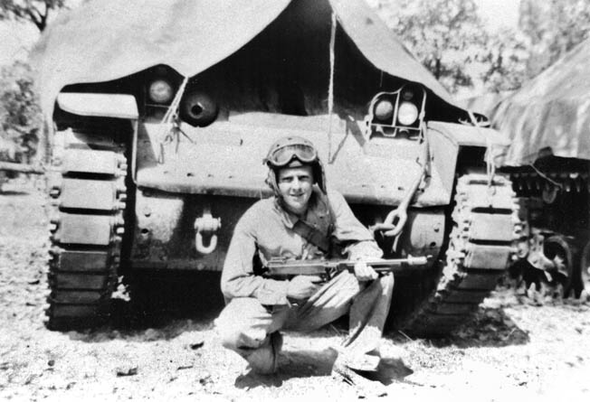 With a Thompson machine gun in hand, Bromberg crouches in front of an M3 Stewart tank. The Stewart proved obsolete by the time the U.S. Army landed in Morocco at the end of 1942.