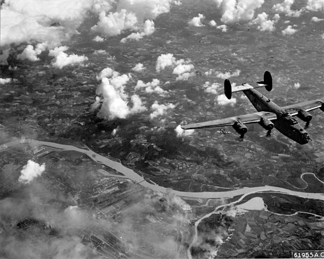 A B-24 (with another flying below) shown on a mission to Linz, Austria, July 25, 1944. Although harder to fly, and not as sleek as the <a href=