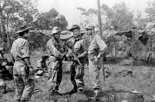 Operatives of OSS Detachment 101 pause for a photograph somewhere in the Burmese jungle. This photo was taken in 1944, and by that time Detachment 101 was executing covert missions that took a heavy toll in Japanese lives and war matériel.