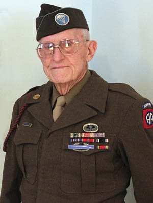 At 94 years old, Nobles still looks good in his original uniform. From time to time he reads the four letters his wife sent him before D-Day. 