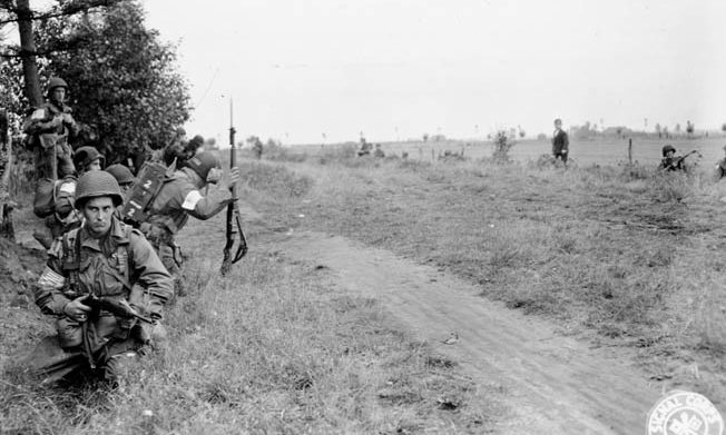 Anticipating contact with German forces at any moment, paratroopers of the 101st Airborne Division gather along a treeline in the Dutch countryside on September 18, 1944. German small arms fire and the deadly accurate 88mm cannon inflicted heavy casualties on the Americans assaulting Best. 