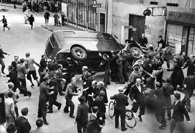 Anti-German anger surfaces in August 1943. Citizens of Odense overturn a police van carrying Danish political prisoners as a protest against German rule and official Danish government collaboration. 