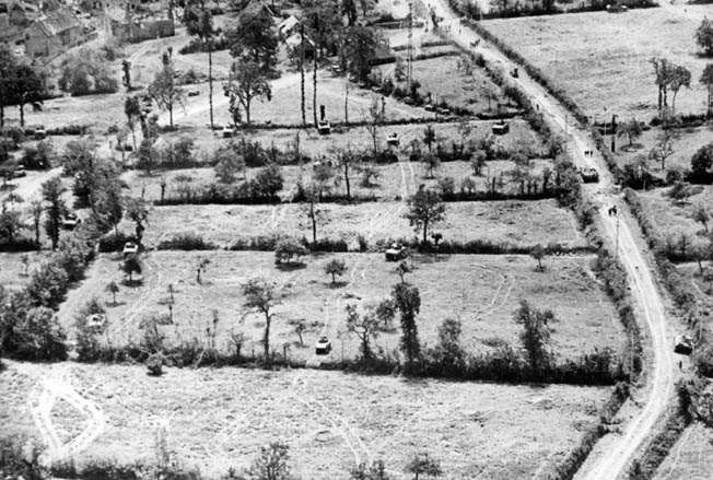 Breaking free of the hedgerows! By lining up a number of Rhino tanks and charging the hedgerows, the 2nd Armored Division finally defeated the maze of earthen ridges that had stalled the Allied forces in Normandy.