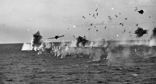 Trying to attack the Yorktown near Truk Island, a Japanese “Jill” torpedo bomber flies through a storm of antiaircraft fire, April 29, 1944. 