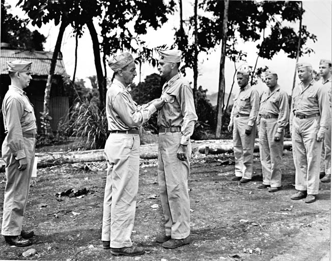 Maj. Gen. Ralph Mitchell (left), commander of 1st Marine Aircraft Wing, awards the Legion of Merit to Colonel Clayton Jerome, May 1944. Jerome later served as C.O. of MAG-32. 