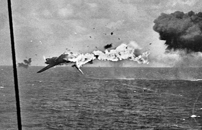 A Japanese “Kate” torpedo bomber takes a direct hit from a 5-inch gun during the same engagement. 