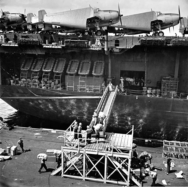 With brand-new Hellcats on the flight deck, the crew boards the Yorktown in May 1943 for the carrier’s shakedown cruise to Trinidad. 