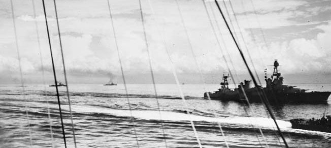 On the fateful day of the Battle of Savo Island, the cruiser USS Chicago is shown maneuvering off the island of Tulagi in the Solomons.