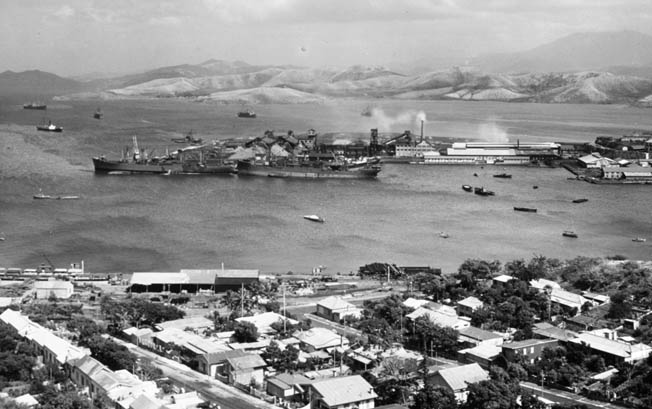 The bustling harbor of New Caledonia is shown in November 1942 as supply ships enter and exit the port. New Caledonia also served as a stopping point for American troops entering the Pacific Theater.