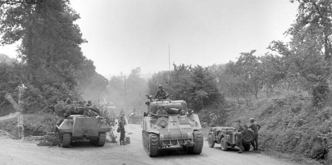 A U.S. armored column musters its resources for yet another advance through the French countryside.