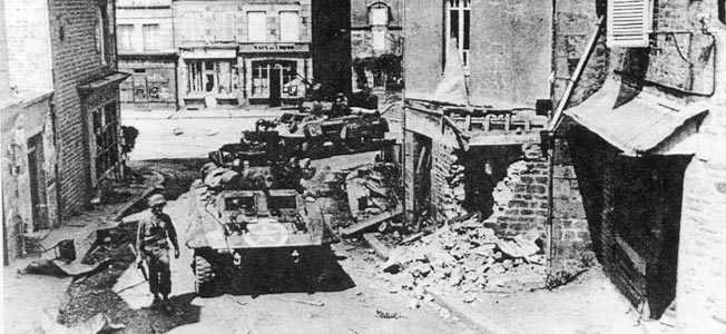 American Sherman tanks battle German Panthers blocking a minor intersection in St. Sever after the Normandy invasion.