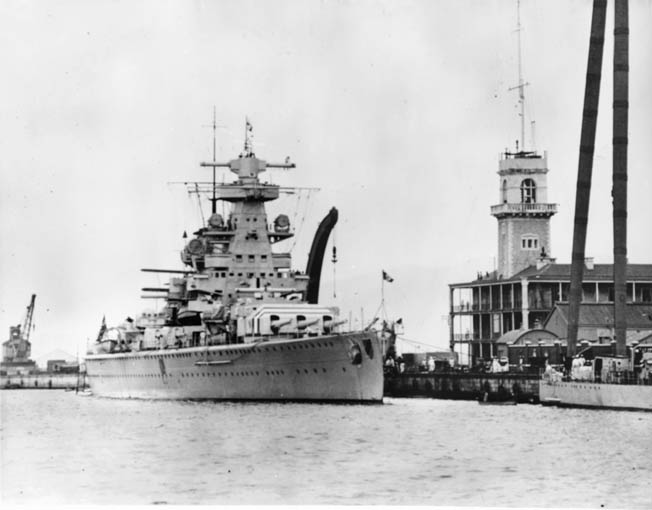 The Admiral Scheer, photographed in port at Gibraltar in 1936 during the Spanish Civil War. The German heavy cruiser was the most successful and feared surface raider of the war.