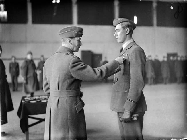 England’s King George VI confers a bar to the Distinguished Flying Cross to Hurricane Pilot Albert Gerald “Zulu” Lewis for shooting down five enemy aircraft in one day in September 1940.