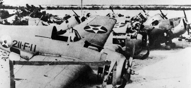 In just fifteen seconds, the Japanese inflicted heavy damage and shock to Wake Island’s Marines. Four Marine aviators rushed toward their aircraft intent on offering resistance to the 36 Japanese twin-engine bombers that riddled Wake, but not one reached his plane.