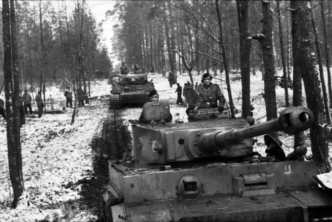 A PzKpfw. VI Tiger I of SS Panzer Division “Das Reich” advances along a snow-covered country road near Kirovograd, Russia. 