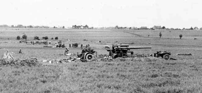 Three German 88 FLAK 18s lightly dug in for ground combat. 21 May 1940? Arras area.