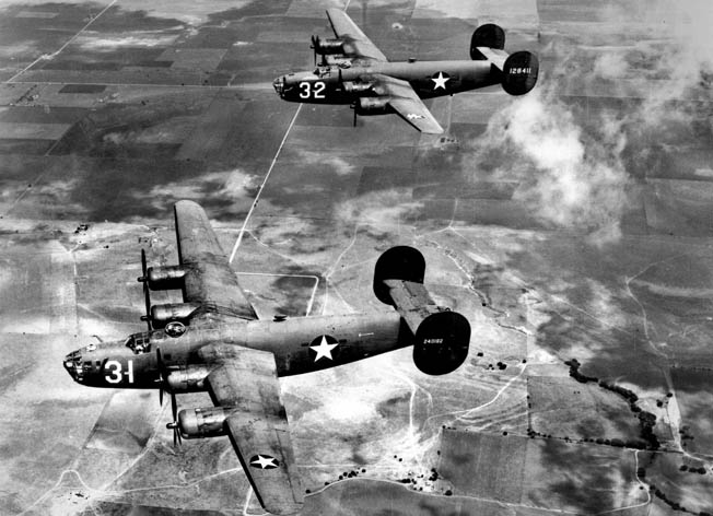 Two Consolidated B-24 Liberators in flight. The airplane was suitable for long, over-water missions