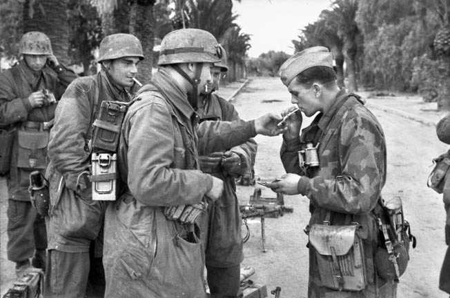 Members of Fallschirm Brigade “Ramcke” take a cigarette break during an operation in Tunisia, November 1942. Statetzny avoided capture while with the Ramcke Brigade.