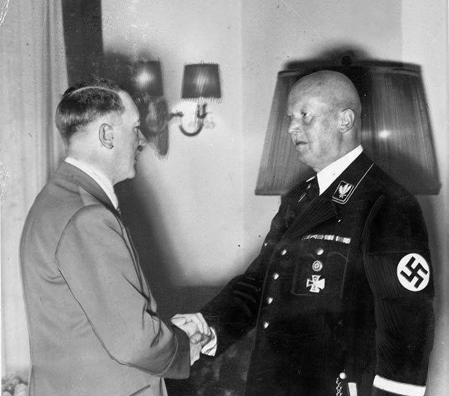 Adolf Hitler congratulates Hans Lammers, Chief of the Reich Chancellery, on the occasion of Lammers’ 60th birthday, May 27, 1939. Lammers was convicted of war crimes by a 1949 tribunal and served approximately 10 percent of his 20-year sentence.