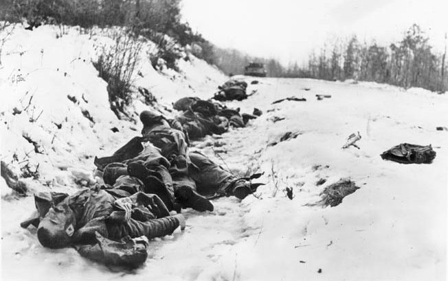 Soviet troops slain in combat lay in a snow-covered ditch in Hungary. When the snow thawed in early March 1945, German panzers bogged down in mud that slowed their advance to a crawl.