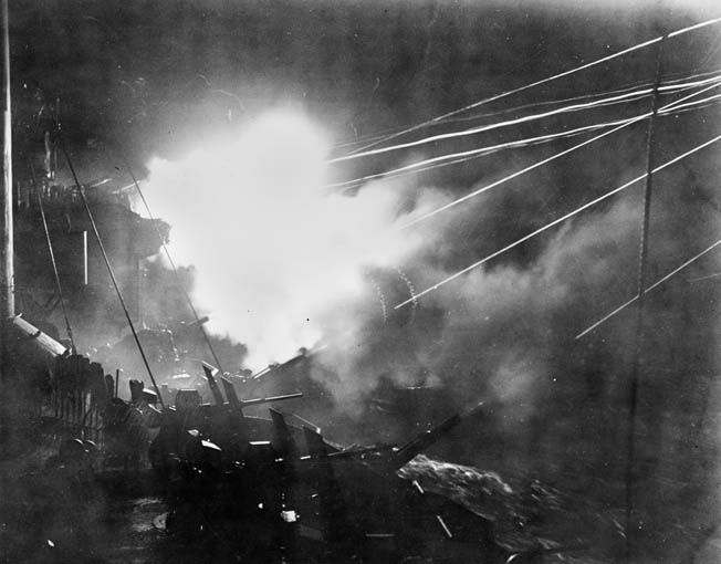 The cruiser USS Boise was damaged during the battle. Repaired and returned to service, the cruiser is shown firing at the enemy during another night engagement in 1944.