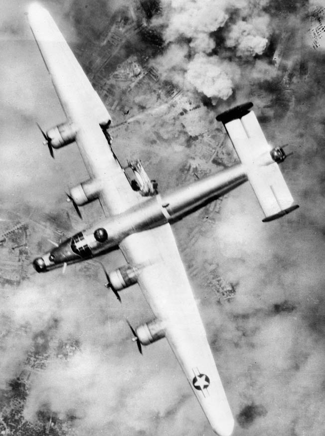 A B-24, with a portion of its right wing damaged by antiaircraft fire during a raid over France in August 1944. The U.S. Eighth Air Force lost approximately 6,000 B-24s and B-17s in operational sorties throughout the war in various theaters. Over 30,000 U.S. airmen were killed or went missing and another 30,000 were captured, making life in the air force extremely hazardous. 