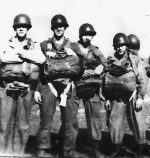 Members of Private Buford’s squad prepare for a practice jump in England prior to deploying to the Continent.