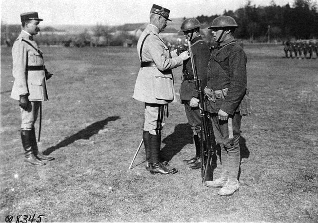 Donovan was a true war hero, awarded the Medal of Honor. Here, as commander of the 1st Battalion, 69th New York Volunteers, in World War I, Major Donovan receives the Legion of Honor from a French general.