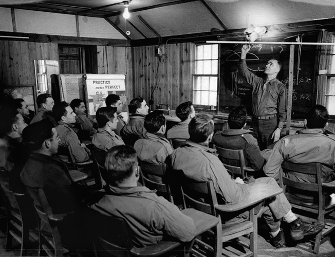 OSS candidates, slated to be dropped behind enemy lines, learn how to set up a clandestine radio antenna. 