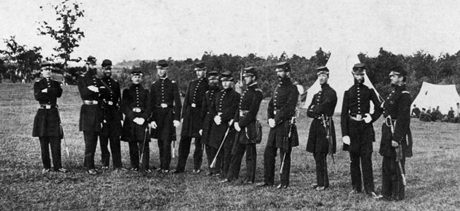 Officers of the 2nd Massachusetts were photographed standing together in more peaceable surroundings in 1861. Regimental commander Colonel William Cogswell stands fourth from the left. 