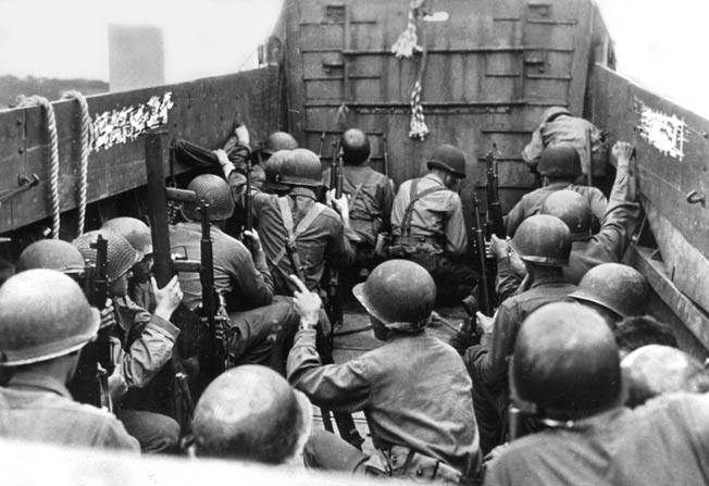 American soldiers ride an LCVP assault craft during the attack on the island fortress of Cezembre, off St. Malo, September 2, 1944. 