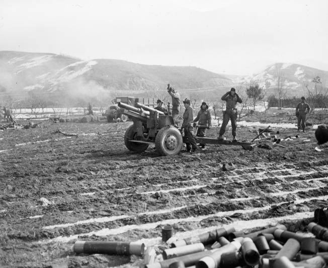 Artillerymen of the U.S. Army X Corps fire on enemy positions at the Chosin Reservoir.