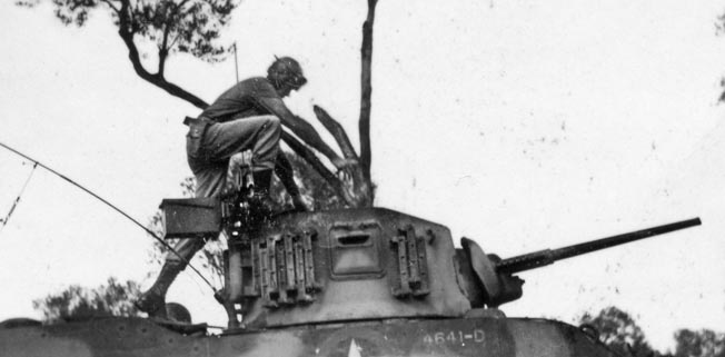 Lieutenant Craig mans his tank. His company spearheaded Patton’s final amphibious assault in Sicily, and, thanks to Craig’s quick thinking, avoided coming under friendly fire.