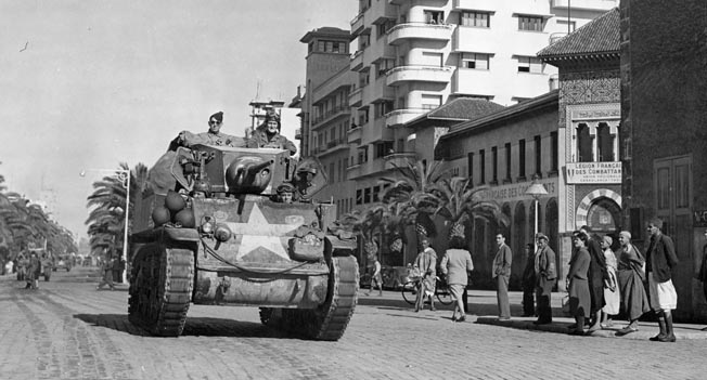 A Stuart tank roars through Casablanca in French Morocco two days after its capture by Patton’s Western Task Force. Some of the locals cheered Craig and his tank company when they entered Casablanca, while others cursed. 