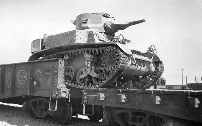 A Stuart rolls off a train bed. When a French yardmaster in Bizerte told Craig he would have to wait to unload his tanks from a train, Craig opted to roll the tanks off, tilting the cars into the air and crashing them back down on the tracks. 