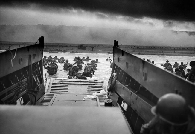 American soldiers wade ashore in Normandy on June 6, 1944, D-Day. Lieutenant Colonel S.L.A. Marshall, Army historian in the European Theater, was critical of operations at Omaha Beach on D-Day and placed the blame for heavy losses on General Bradley.