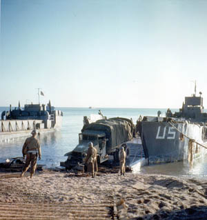 During a quiet D-Day landing rehearsal at Slapton Sands, a truck rolls off the ramp of a landing craft. The Slapton Sands area was chosen for rehearsals of the D-Day operation because the coastline resembled the Utah Beach area in Normandy.