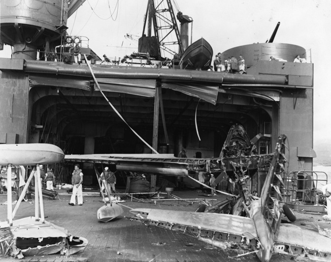 The Curtiss sustained extensive damage to its hangar when a Japanese bomb penetrated the boat deck and three lower decks and exploded in the magazine of the No. 4 gun. Eighteen men were killed, and the 5-inch weapon was put out of action.