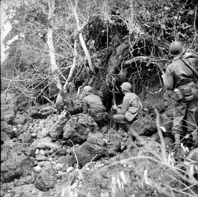 American soldiers crouch temporarily while on patrol through the jungles of New Guinea north of Aitape. Landings at Aitape and Hollandia gave General Douglas MacArthur confi- dence that his enemy was fixed, particularly due to decoded radio intercepts. 