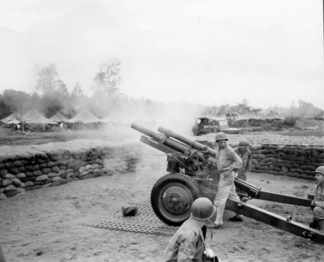 American artillerymen of the 152nd Field Artillery Battalion fire a 105mm howitzer at Japanese positions near Aitape. The prolonged days of fighting at the Driniumor River took their toll on both sides, but in the end the Japanese were decimated.