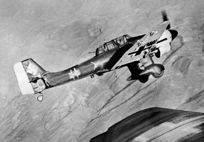 A Junkers Ju-87 Stuka dive bomber of the Luftwaffe wings over as its pilot acquires a target while flying above embattled Yugoslavia. 