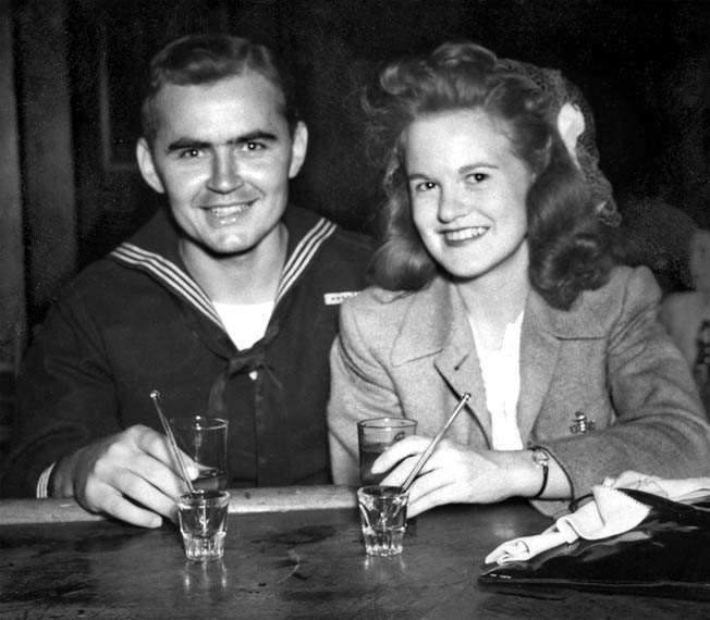 Back home in Chicago, Ed Reynolds and his sweetheart Mary Ellen Murphy catch up on lost time. 