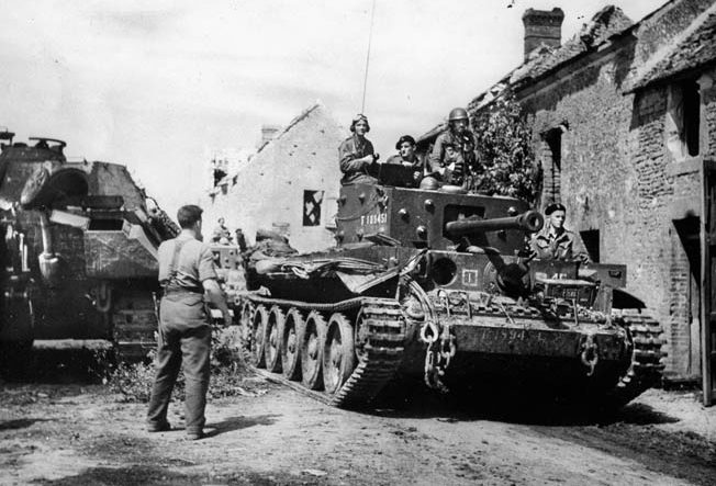 A 1st Polish Armoured Division Cromwell tank rolls through a French village on the way to Mount Ormel, where the Poles would make a courageous defensive stand.