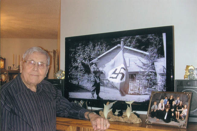 Norvald Flaaten fondly remembered his moment of fame during the shooting of a feature film. Flaaten provided a dramatic flourish at the end of the movie, tearing down the Nazi flag.