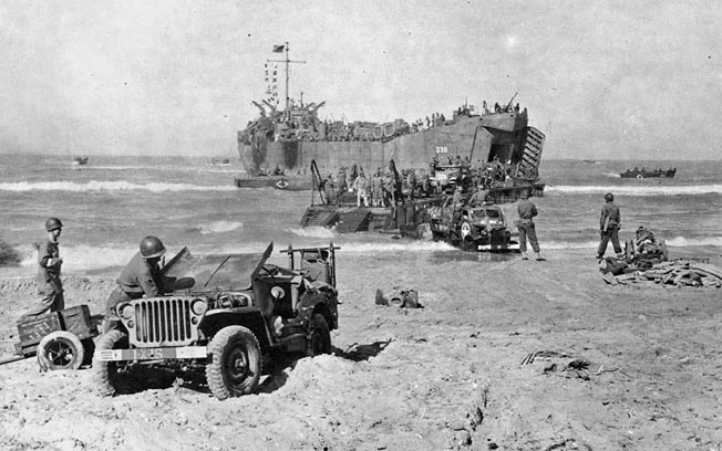 Vehicles land in Sicily. Although the fighting had already moved inland when Craig landed at Gela Beach, enemy artillery salvos still exploded around his tank. 