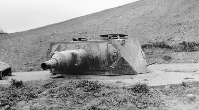 A tank turret on Omaha Beach. The Germans frequently incorporated the turrets of captured enemy tanks into their fortifications. 