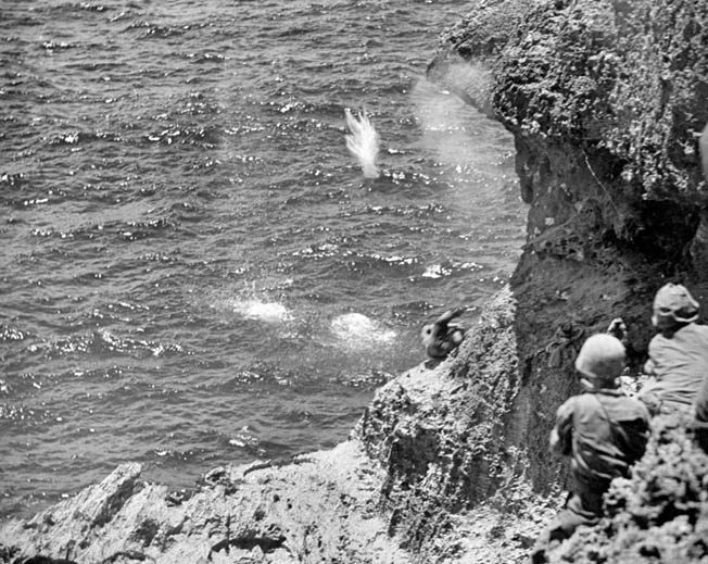 Believing horrific tales of American atrocities fabricated by Japanese military propagandists, Japanese civilians commit suicide by flinging themselves and their children from the cliffs at Marpi Point on the island of Saipan. Unable to intervene, U.S. Marines watch helplessly as the civilians end their lives by drowning or falling on the rocks below. 