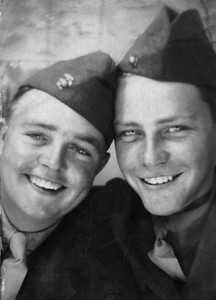 U.S. Marines W.O. Brown (left) and buddy Sid Phillips cram themselves into a photo booth