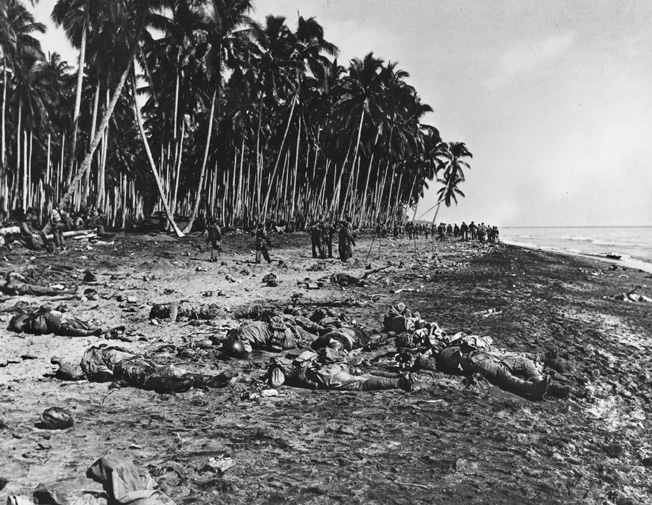 As the battle wound down, some Japanese troops tried to escape by heading into the ocean, but many were cut down as they crossed the beach, and others shot in the surf. This photograph was taken the day after the battle.